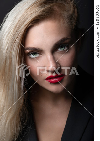 Beautiful woman with long white hair close-up and red lips studio portrait Beautiful woman with long white hair close-up and red lips studio portrait 129903055