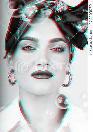 Portrait of beautiful woman with scarf on her head and flying soap bubbles in RGB color split style 129903070