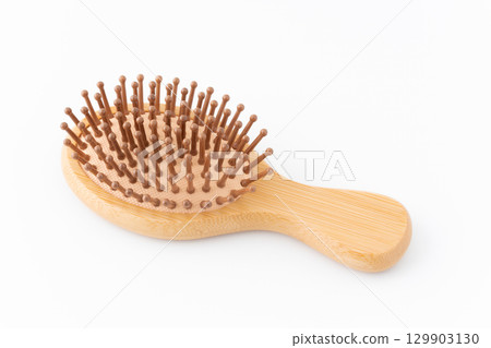 Bamboo hairbrush on white background 129903130