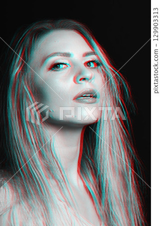 Beautiful woman with close-up studio portrait in RGB color split effect style 129903313
