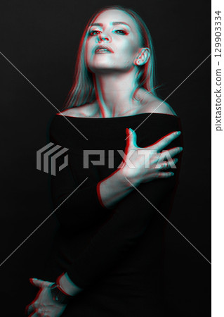 Beautiful woman with black dress studio portrait in RGB color split effect style Beautiful woman with black dress studio portrait in RGB color split effect style 129903334