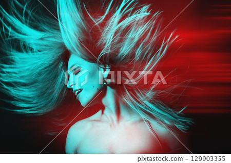 Beautiful woman with flying hair studio portrait in RGB color split effect style 129903355