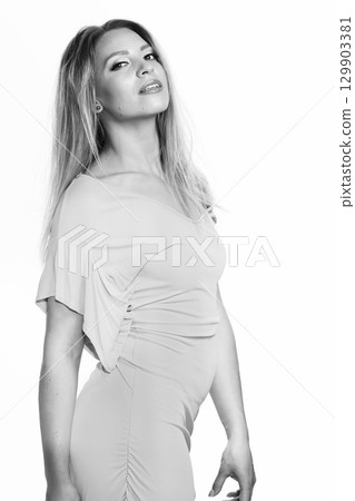 Beautiful woman with dress black and white studio portrait 129903381