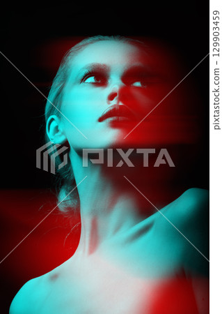 Beautiful woman with fancy make-up close-up studio portrait in RGB color split effect style Beautiful woman with fancy make-up close-up studio portrait in RGB color split effect style 129903459