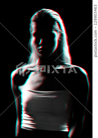Studio portrait of woman silhouette partly illuminated with light in RGB color split effect style Studio portrait of woman silhouette partly illuminated with light in RGB color split effect style 129903463