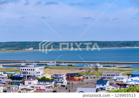A view of Hamanaka Town and the sea under a blue sky A view of Hamanaka Town and the sea under a blue sky 129903513