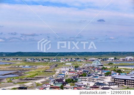 A view of Hamanaka Town and the sea under a blue sky 129903516