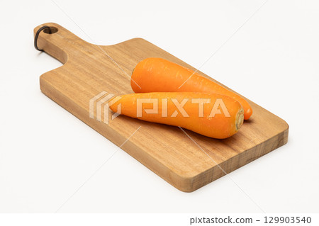 Carrots on a cutting board Carrots on a cutting board 129903540