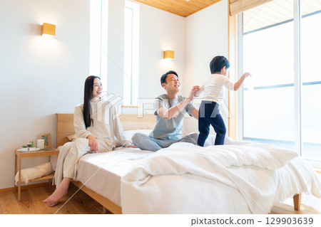 Young family having a conversation in the bedroom Young family having a conversation in the bedroom 129903639