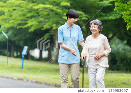 Senior woman and caregiver rehabilitation 129903697
