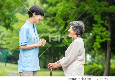 Senior woman talking to a caregiver Senior woman talking to a caregiver 129903700