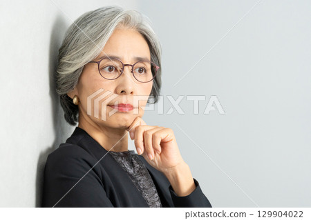 Senior woman thinking Senior woman thinking 129904022