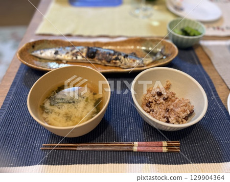 Japanese meal with red chopsticks 129904364