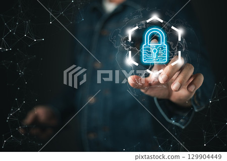 A businessman interacts with a futuristic digital interface displaying a glowing padlock icon, symbolizing secure cyber data protection, privacy, encryption, and online security measures. A businessman interacts with a futuristic digital interface displaying a glowing padlock icon, symbolizing secure cyber data protection, privacy, encryption, and online security measures. 129904449