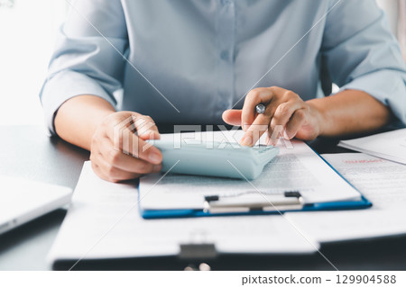 Business person with contract law and paper work for business finance, loan application form, contract real estate and insurance concept. signing contract, working on desk, business document 129904588