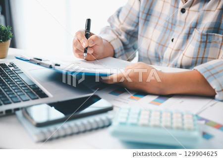 Woman calculating monthly home expenses, taxes, bank account balance and credit card bills payment, Income is not enough for expenses. financial planning, business calculate tax, investment finance. 129904625