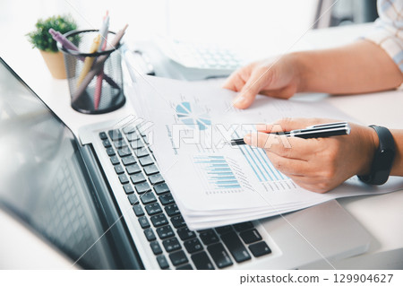 Businesswoman analysis with financial data, marketing business strategy project, Business financing accounting banking concept, finances, calculate about cost to real estate investment, tax system. Businesswoman analysis with financial data, marketing business strategy project, Business financing accounting banking concept, finances, calculate about cost to real estate investment, tax system. 129904627