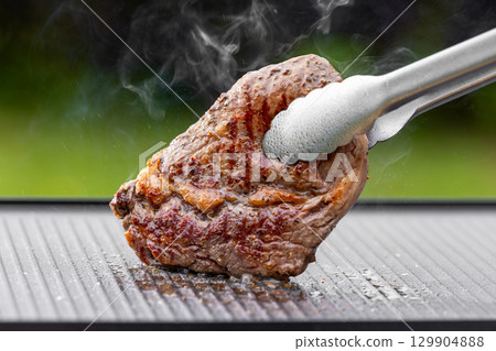 freshly grilled beef ribeye steak 129904888