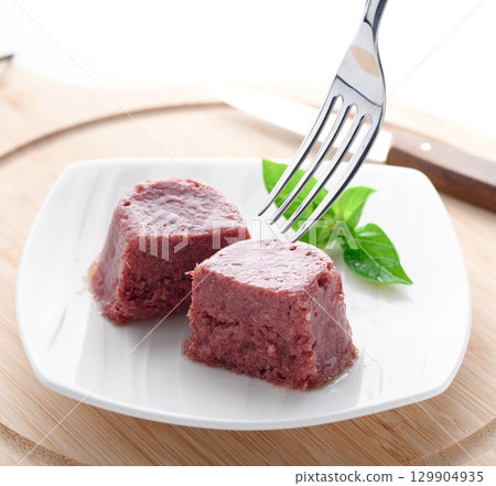 Corned beef served on a white plate - a food image that enhances the texture and appetite 129904935