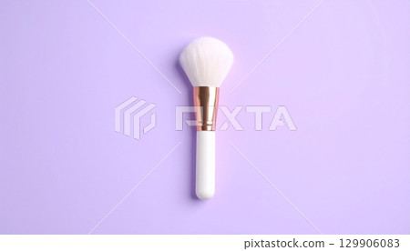 Simple makeup brushes on a pale lavender background Simple makeup brushes on a pale lavender background 129906083