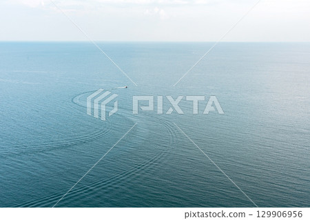 Boat leaving wake on water. Sea walks, summer vacation. Boat leaving wake on water. Sea walks, summer vacation. 129906956