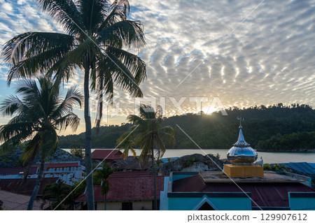 Sunset over Pulau Papan mosque and village, Malenge, Sulawesi, Indonesia Sunset over Pulau Papan mosque and village, Malenge, Sulawesi, Indonesia 129907612