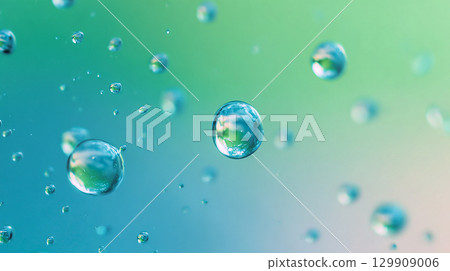 Floating water droplets blue green abstract background Floating water droplets blue green abstract background 129909006