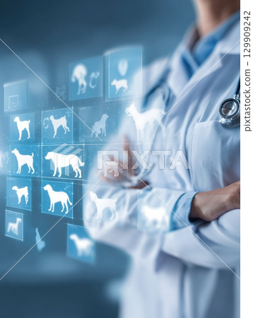 Veterinarian Assesses Animal Health Data Using Digital Technology in Modern Clinic Setting 129909242