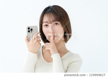 Young woman, casual, smartphone, secret Young woman, casual, smartphone, secret 129909627