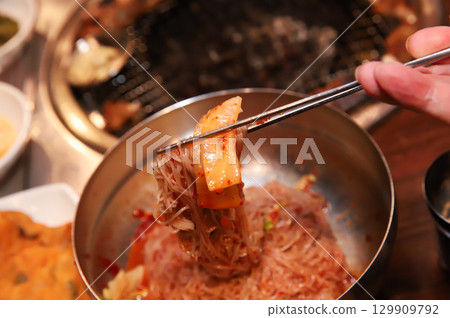 Korean noodle food. Bibim naengmyeon (cold buckwheat noodles) with Korean bbq meat Korean noodle food. Bibim naengmyeon (cold buckwheat noodles) with Korean bbq meat 129909792