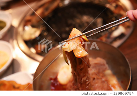 Korean noodle food. Bibim naengmyeon (cold buckwheat noodles) with Korean bbq meat 129909794
