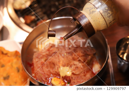 Korean noodle food. Bibim naengmyeon (cold buckwheat noodles) with Korean bbq meat 129909797