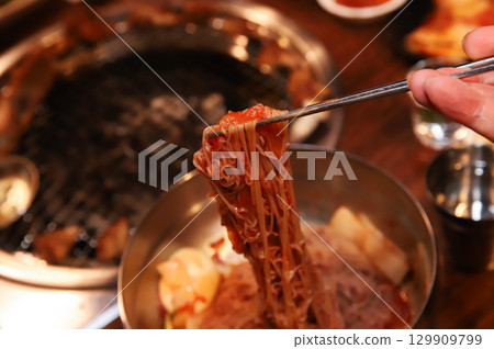 Korean noodle food. Bibim naengmyeon (cold buckwheat noodles) with Korean bbq meat Korean noodle food. Bibim naengmyeon (cold buckwheat noodles) with Korean bbq meat 129909799