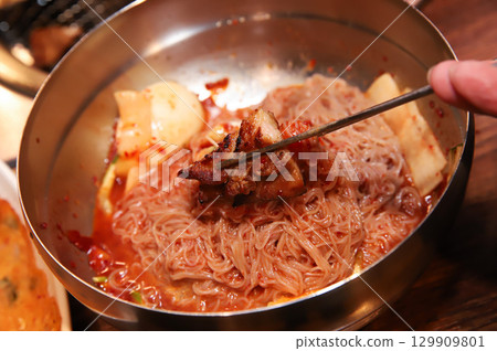 Korean noodle food. Bibim naengmyeon (cold buckwheat noodles) with Korean bbq meat Korean noodle food. Bibim naengmyeon (cold buckwheat noodles) with Korean bbq meat 129909801