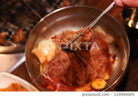 Korean noodle food. Bibim naengmyeon (cold buckwheat noodles) with Korean bbq meat 129909805