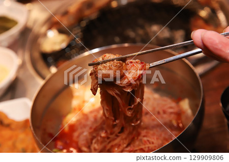 Korean noodle food. Bibim naengmyeon (cold buckwheat noodles) with Korean bbq meat 129909806