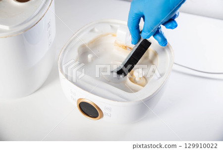 Cleaning the humidifier from scale and rust, microorganisms and unpleasant odors. Cleaning agent. Maintenance of humidifiers, close-up 129910022