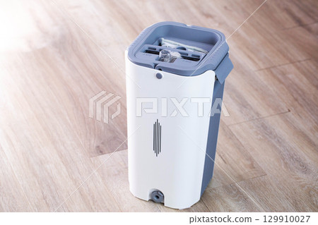 Gray modern bucket for cleaning and cleaning the room, copy space for text, industry Gray modern bucket for cleaning and cleaning the room, copy space for text, industry 129910027