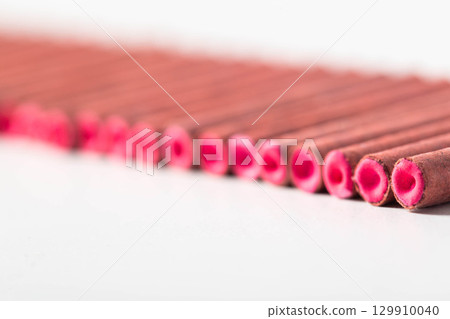 A bunch of firecrackers with red sulfur. Set of pyrotechnics, explosion hazard, macro. Copy space for text 129910040