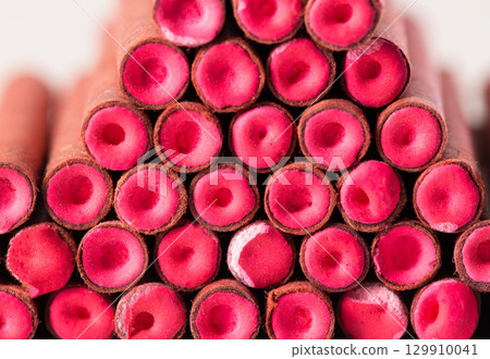 A bunch of firecrackers with red sulfur. Set of pyrotechnics, explosion hazard, macro. 129910041