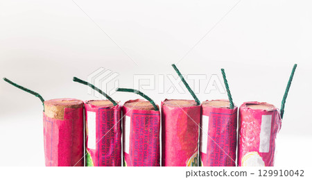 Set of colorful beetles firecrackers with wicks on a white background, close-up. Fireworks Explosion Safety 129910042