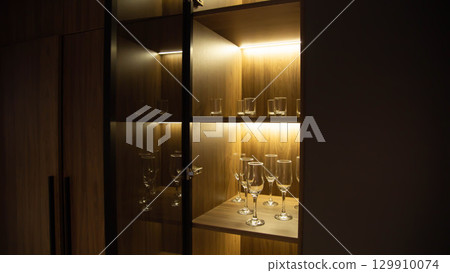 Custom cabinet with LED strip in shelves, beautiful design, close-up, technology 129910074