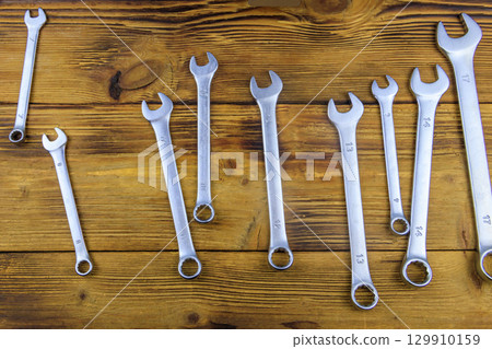 Set of wrench tools on wooden background. Top view Set of wrench tools on wooden background. Top view 129910159