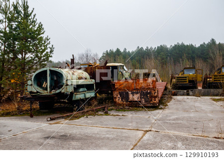 Old rusty abandoned damaged trucks in Chernobyl exclusion zone, Ukraine Old rusty abandoned damaged trucks in Chernobyl exclusion zone, Ukraine 129910193