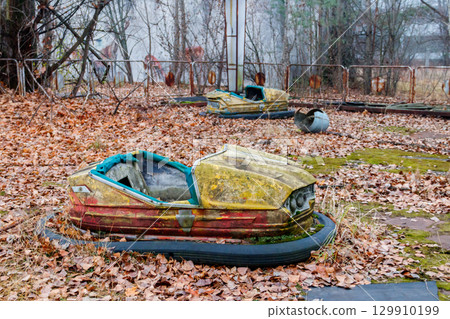 Abandoned bumper cars in the amusement park of Pripyat city in Chernobyl Exclusion Zone, Ukraine Abandoned bumper cars in the amusement park of Pripyat city in Chernobyl Exclusion Zone, Ukraine 129910199