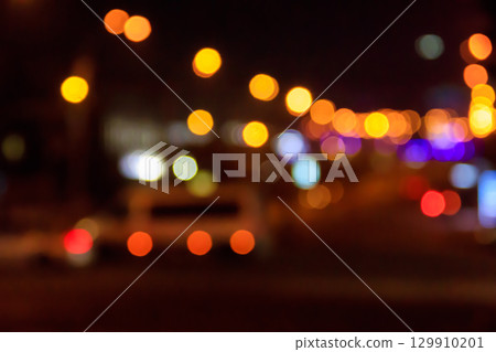Bokeh blurred car lights at night. Abstract background Bokeh blurred car lights at night. Abstract background 129910201