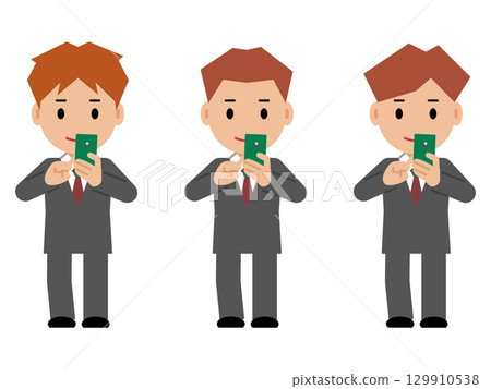 一位身穿灰色西裝的年輕人正在操作智慧型手機 129910538