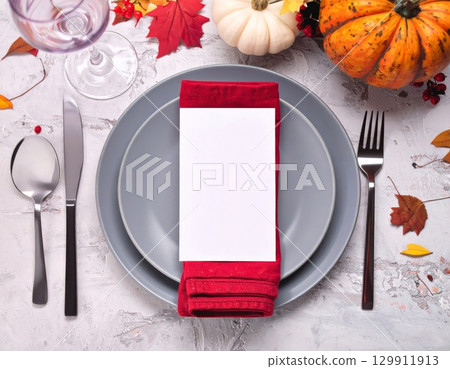 Festive Autumn Table Setting with Gray Plate and Red Napkin Top View 129911913