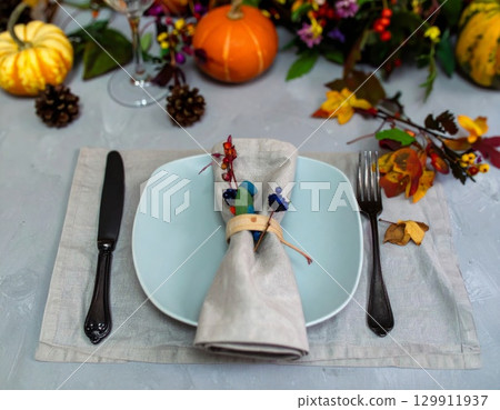 Festive Fall Table Setting with Pumpkins Gourds and Autumn Leaves Holiday Decoration 129911937