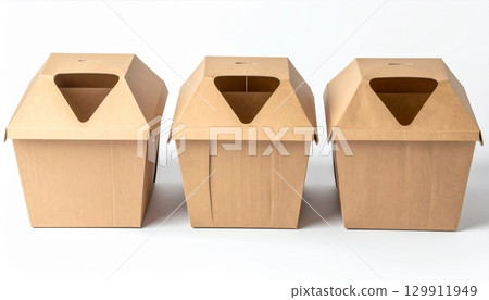 Three Identical Brown Cardboard Boxes with Handles in Studio Lighting 129911949